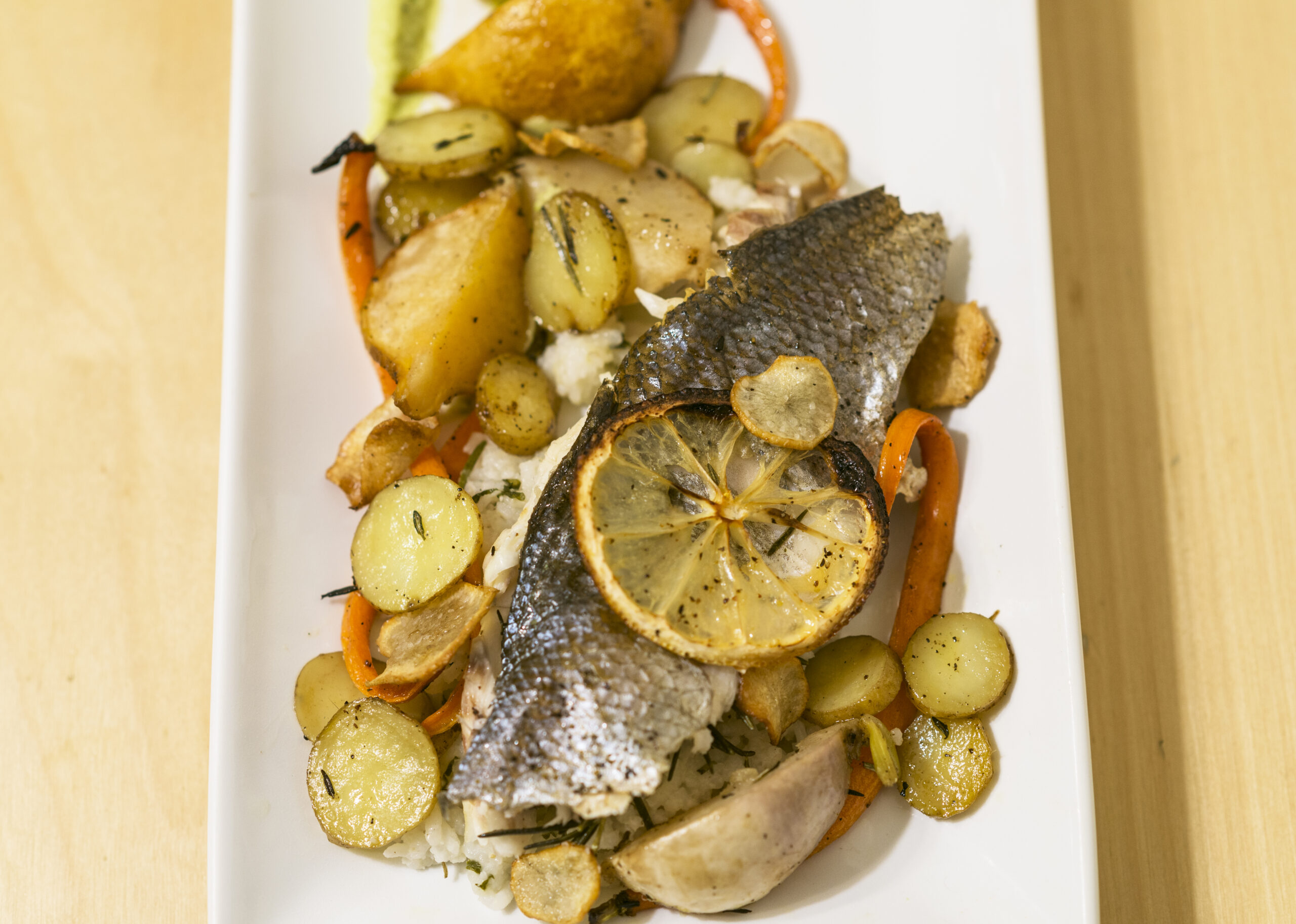 Plated Mediterranean Seabass with Lemon and Veggies - Branzino