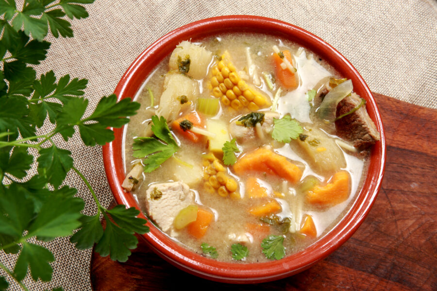 Sancocho de Costilla or Gallina is a traditional Colombian and Latin American soup or stew made with many kinds of meat including Chicken Hen Pork Beef Fish and Oxtail. With Yucca Plantain Potato Cassava and vegetables from the local region. 