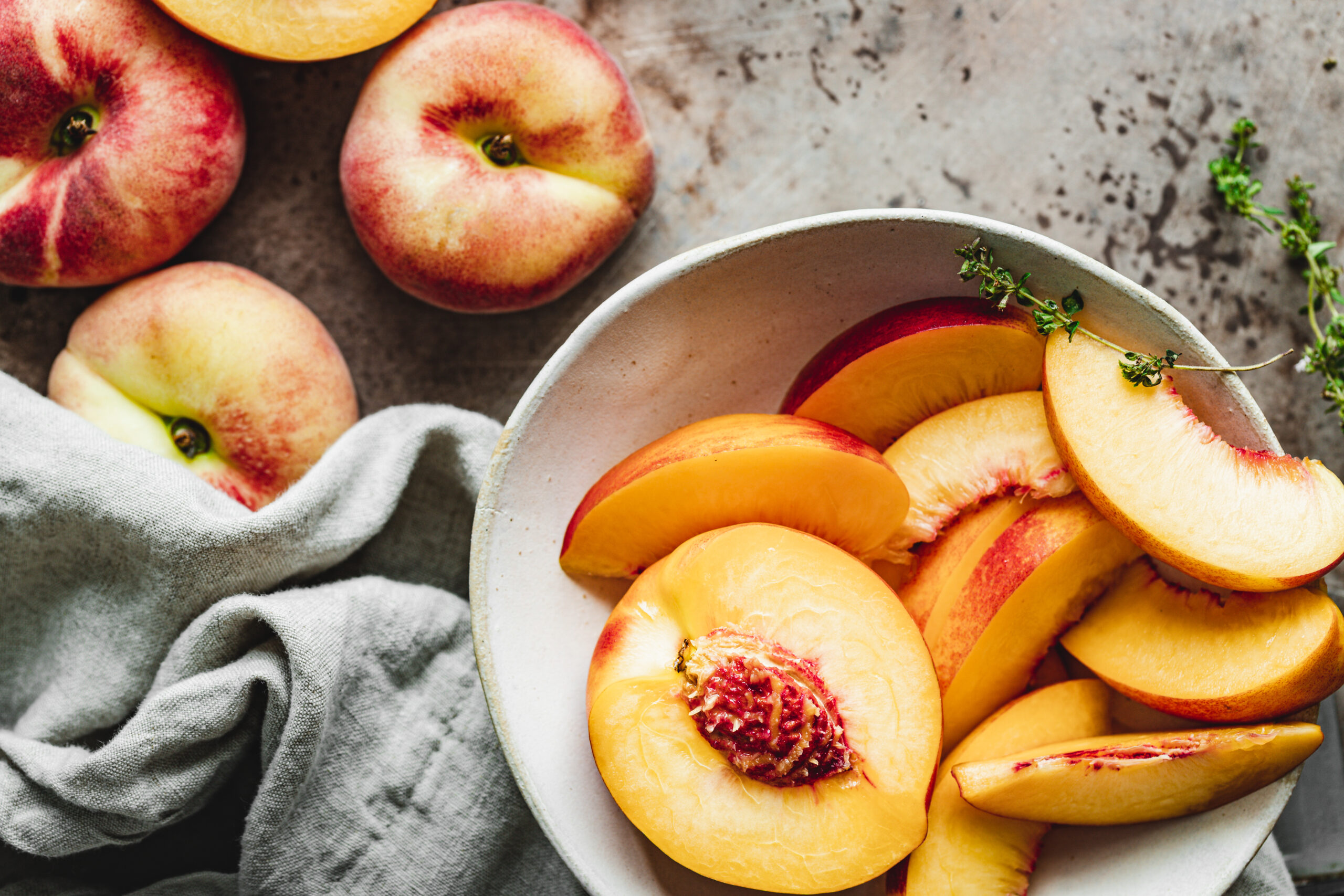 Top view of slices of peach in a bowl. Close-up of ripe peaches slices.