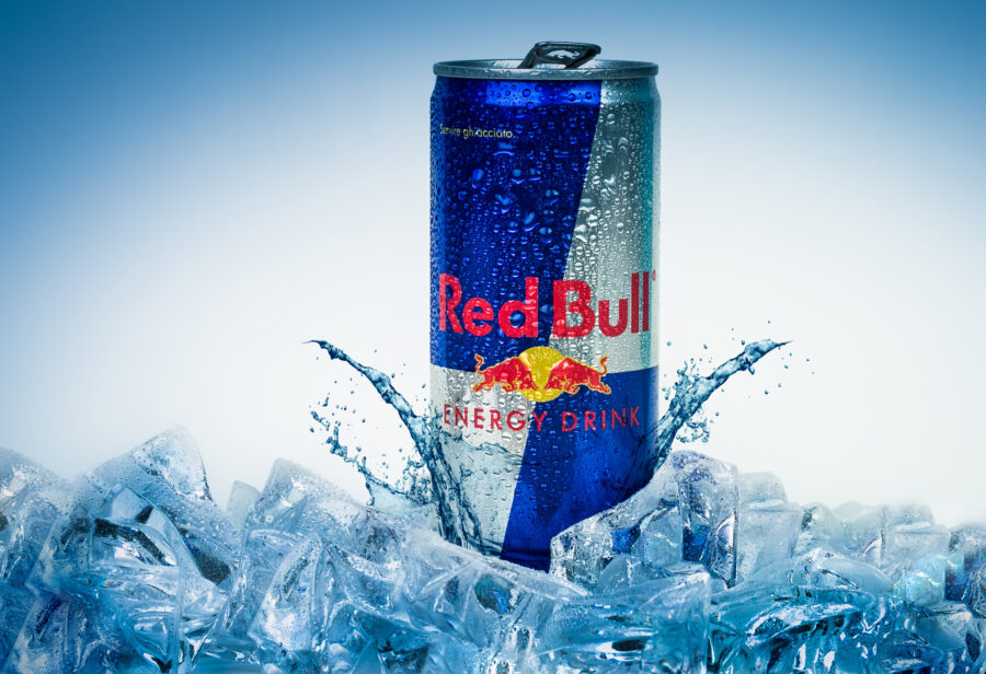 Aluminium can of Red Bull Energy drink iced Background.