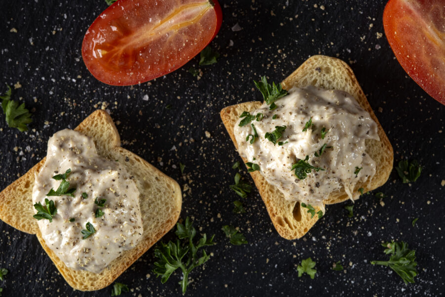 Tuna paste spread on small toast slices - top view