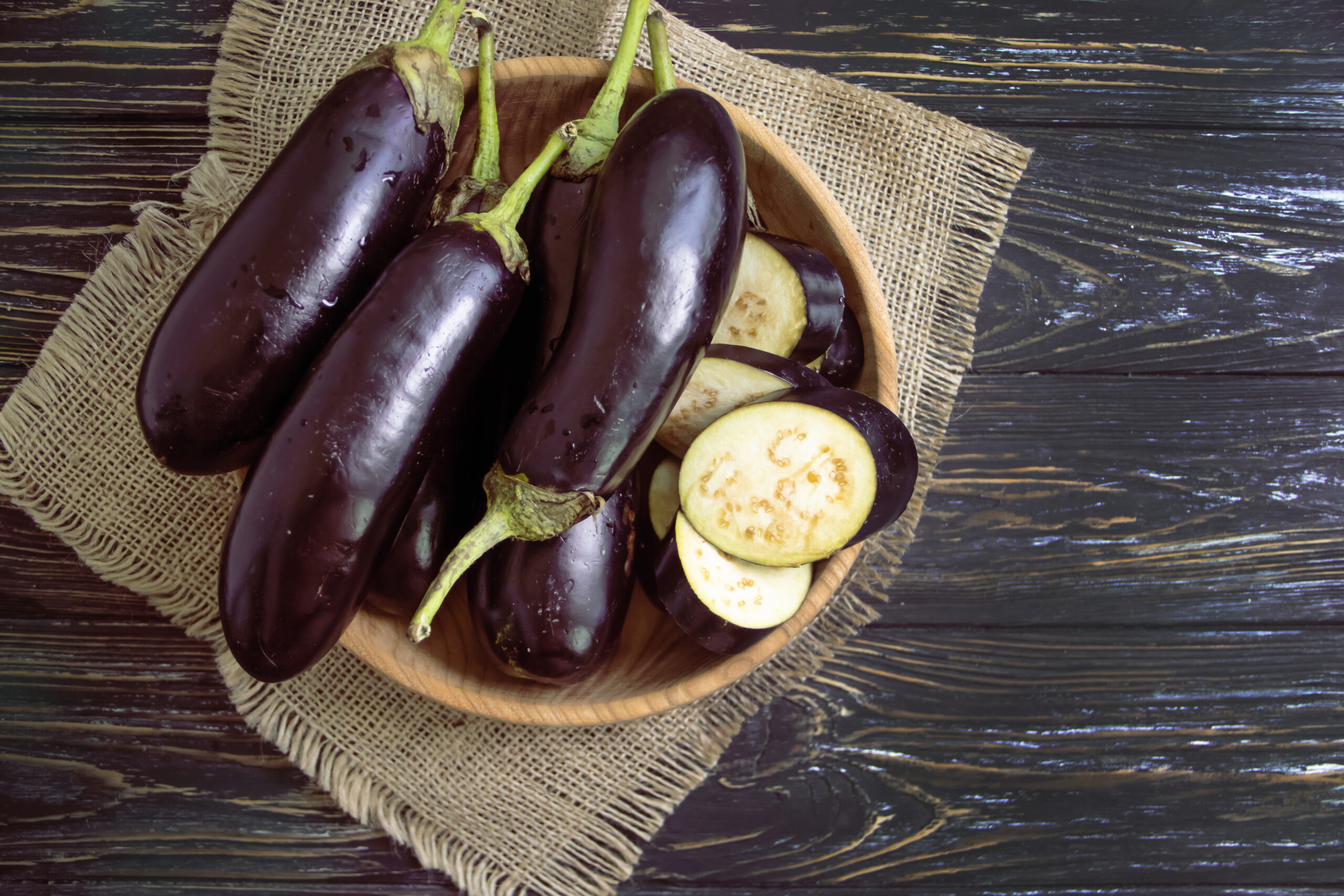 whole eggplant on wooden background