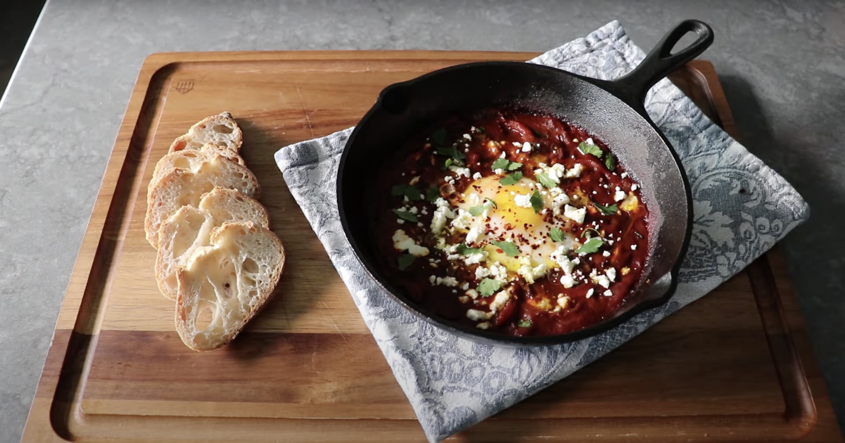 Shakshuka, made by Chef John on the Food Wishes YouTube Channel. Image taken from the "Shakshuka for One" video.