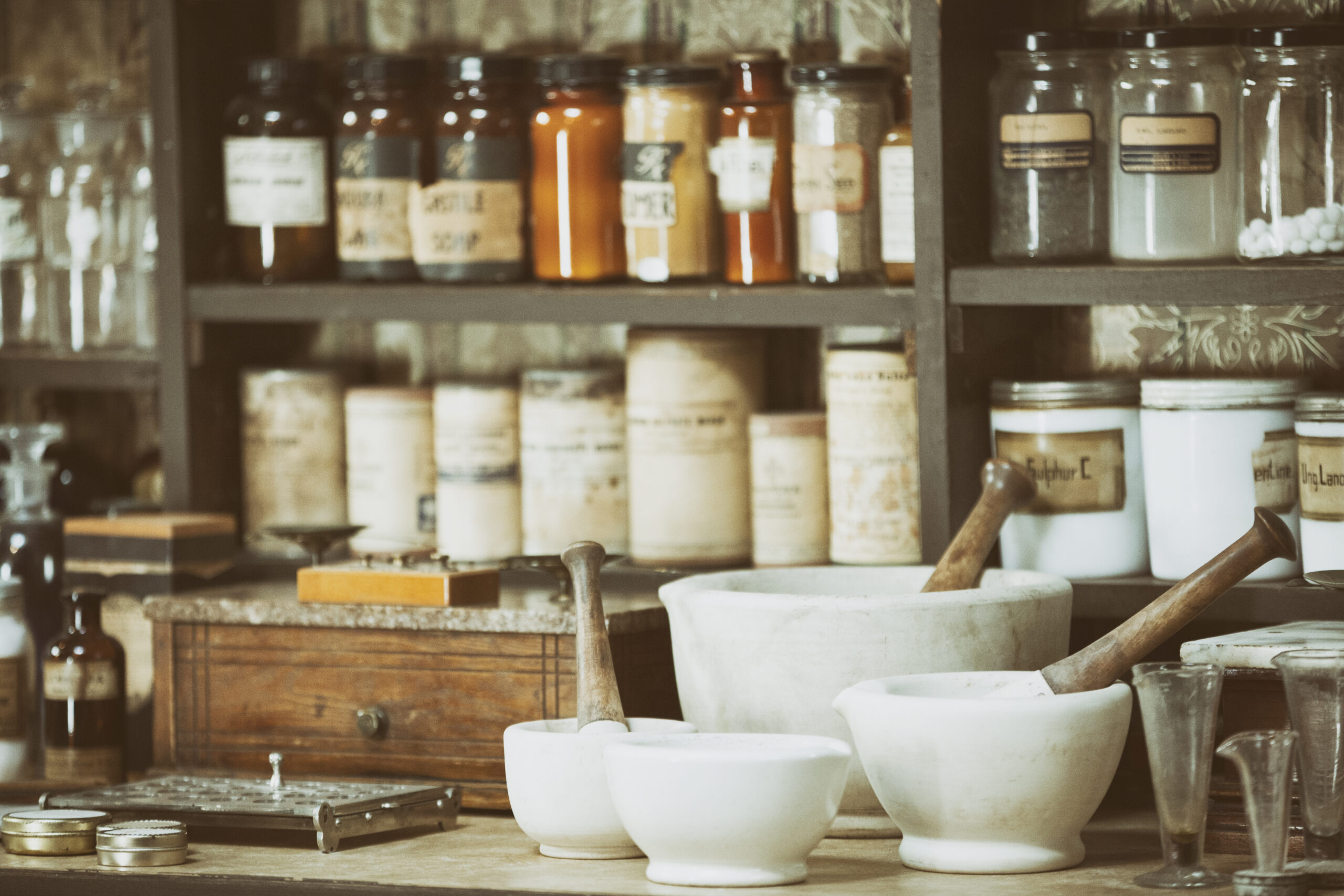 A collection of vintage turn of the 20th century chemicals and equipment used in medicine at the time.