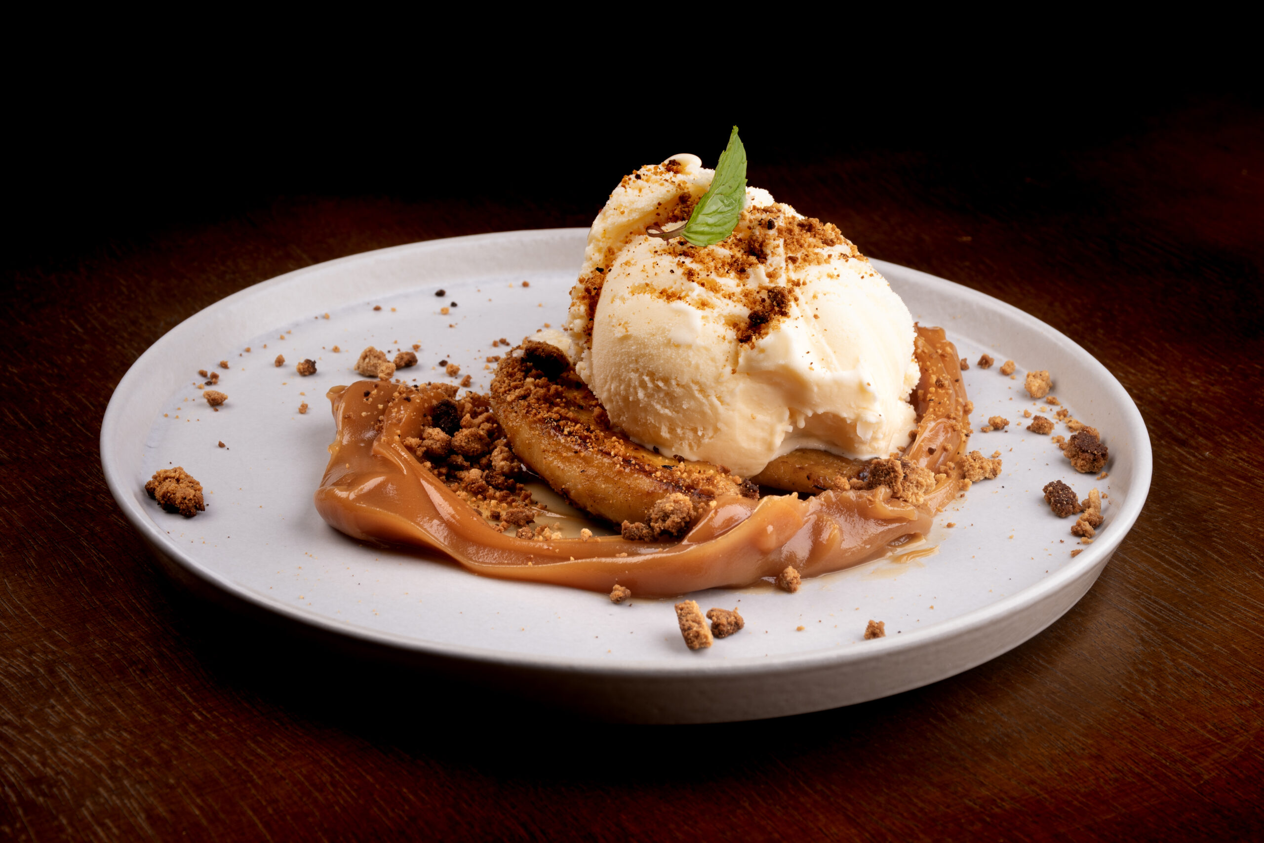 banoffee dessert with banana dulce de leche vanilla ice cream and angle-ground biscuit