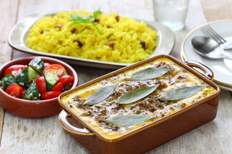 bobotie is a curry flavored meatloaf with baked egg on top.