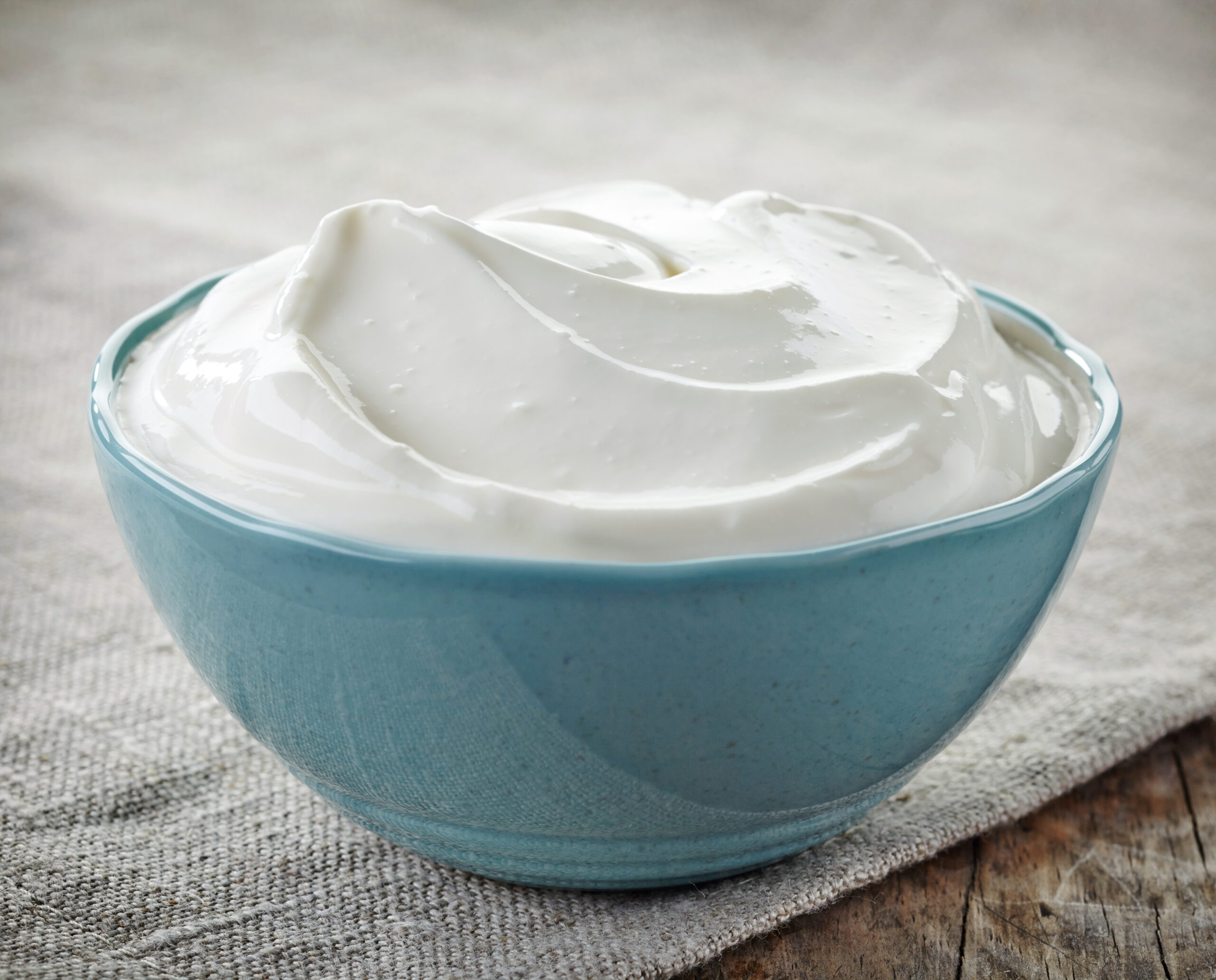 bowl of sour cream on linen napkin