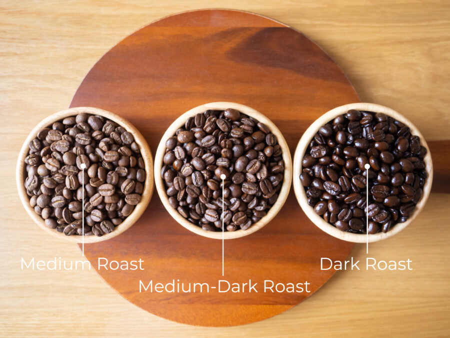 brown arabica coffee bean roast 3 level medium to dark different taste seed caffeine espresso drink food cafe beverage Chiang Rai, Thailand coffee on wooden table background top view selected focus