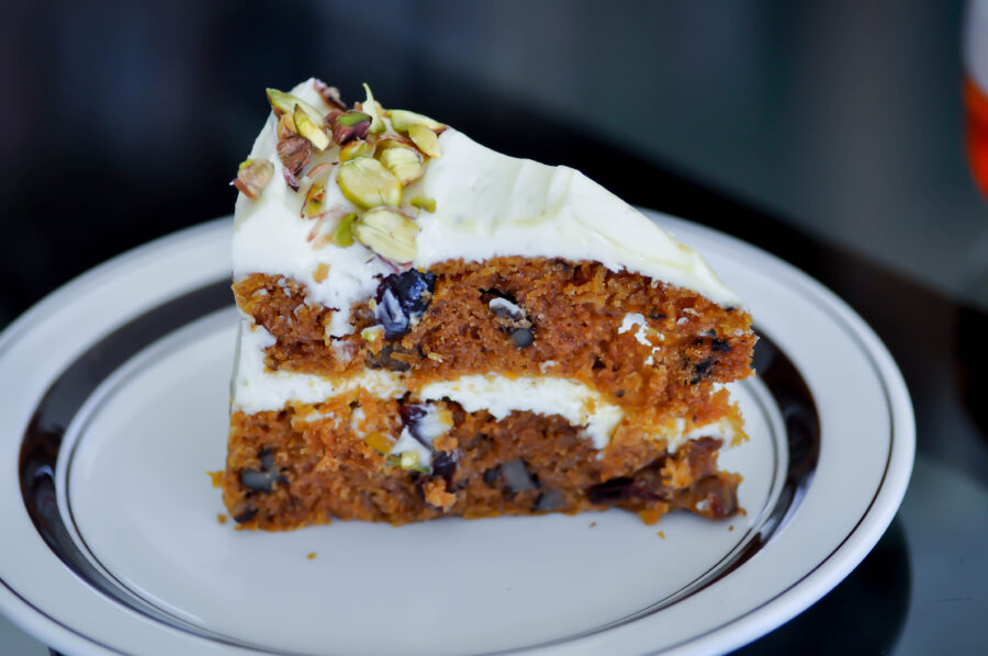 carrot and raisin cake with pistachio topping , carrot cake or fruit cake