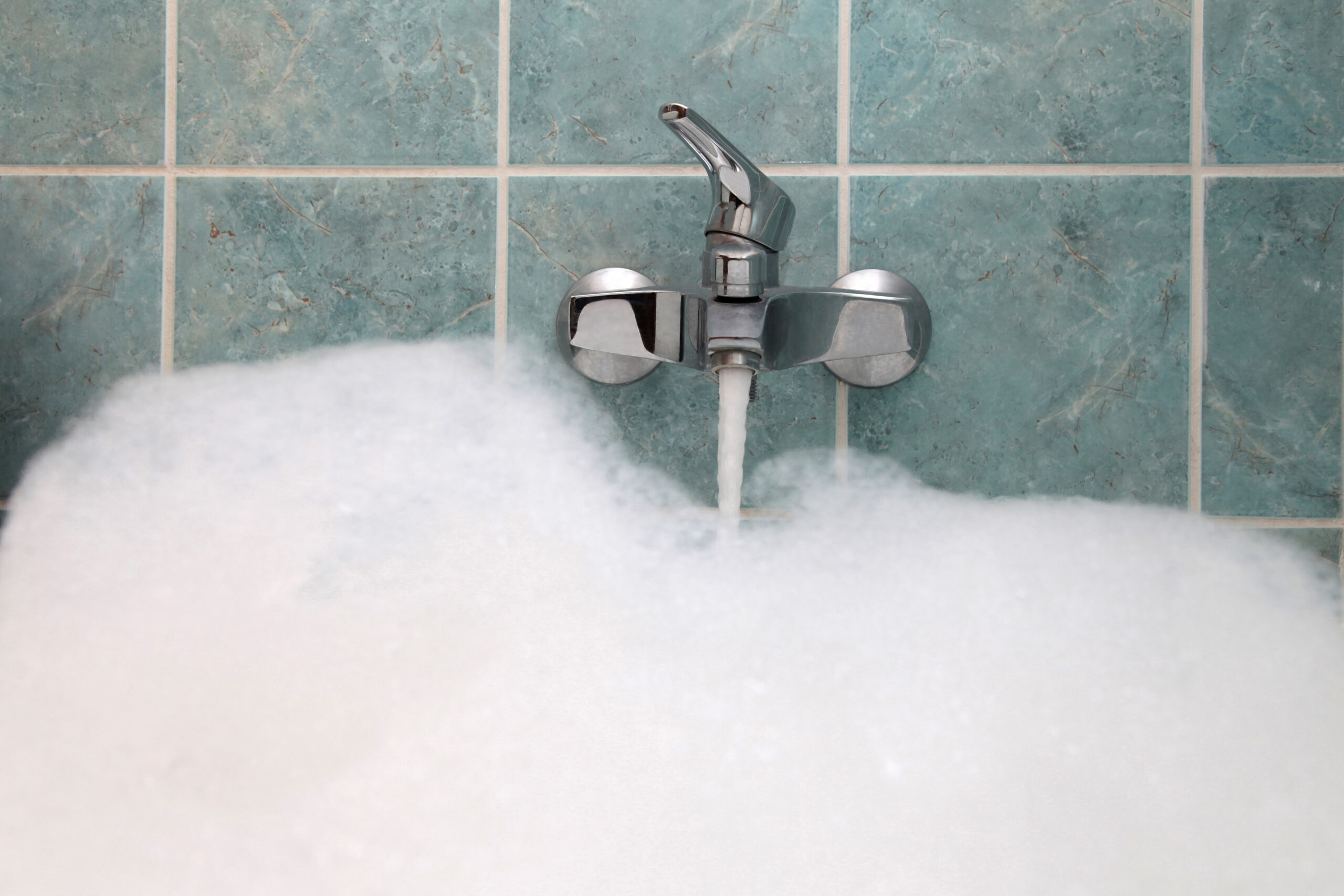 Close up of a bathtub filling with water