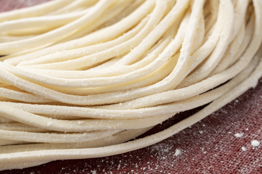 Close-up of fresh udon. Udon noodles before boiling. Freshly made udon.