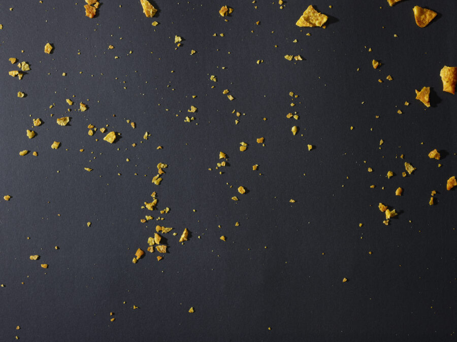 Corn Chips Crumbs on dark background