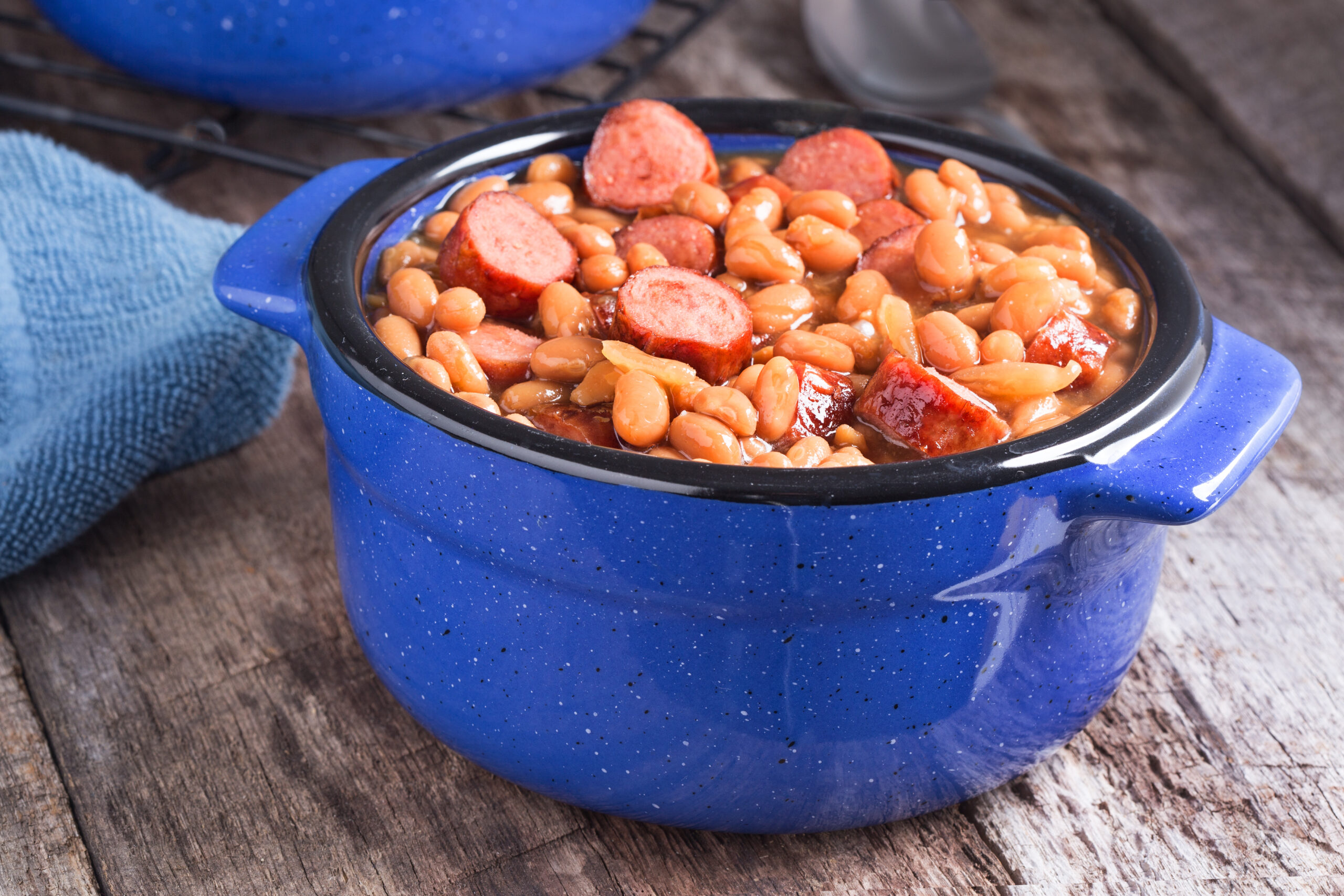 Franks and beans in blue ceramic bowl