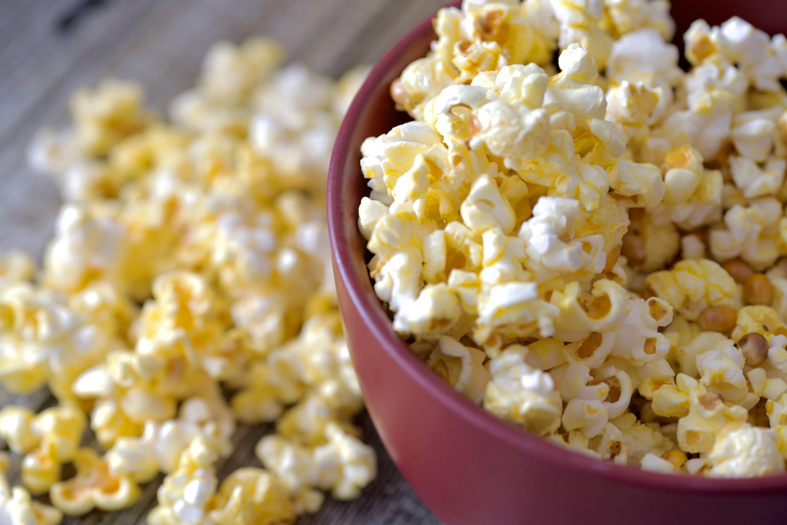 Freshly made popcorn seasoned with butter in a bowl