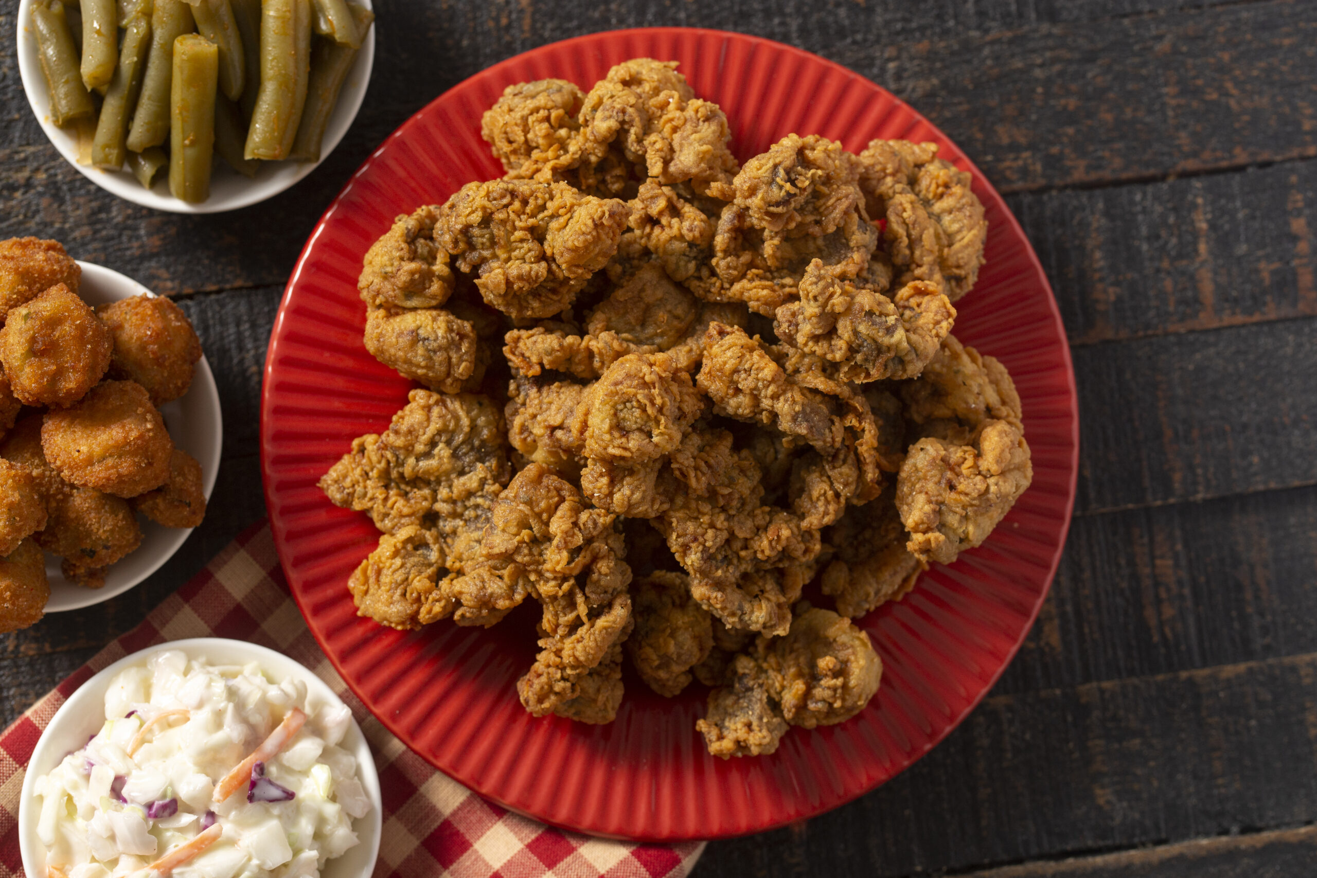 Fried and Crispy Chicken Gizzards on a Rustic Wooden Table