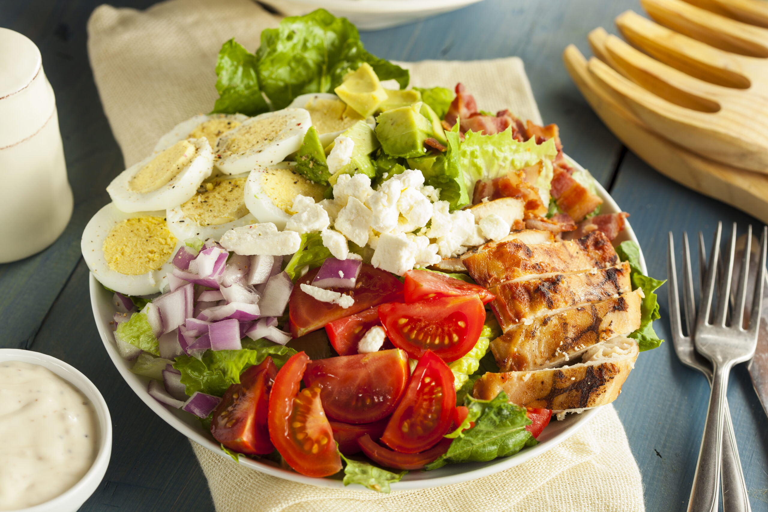 Healthy Hearty Cobb Salad with Chicken Bacon Tomato Onions and Eggs