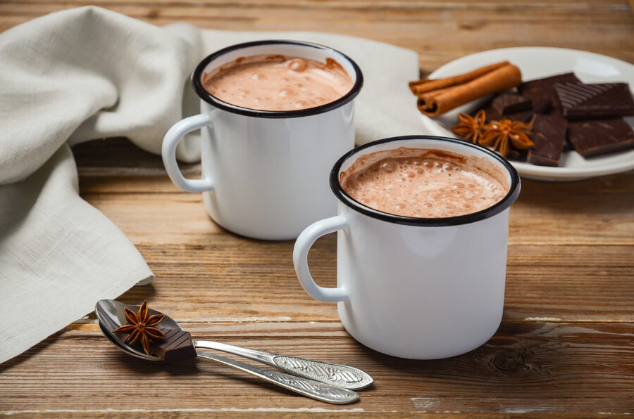 Hot chocolate on rustic wooden table, selective focus