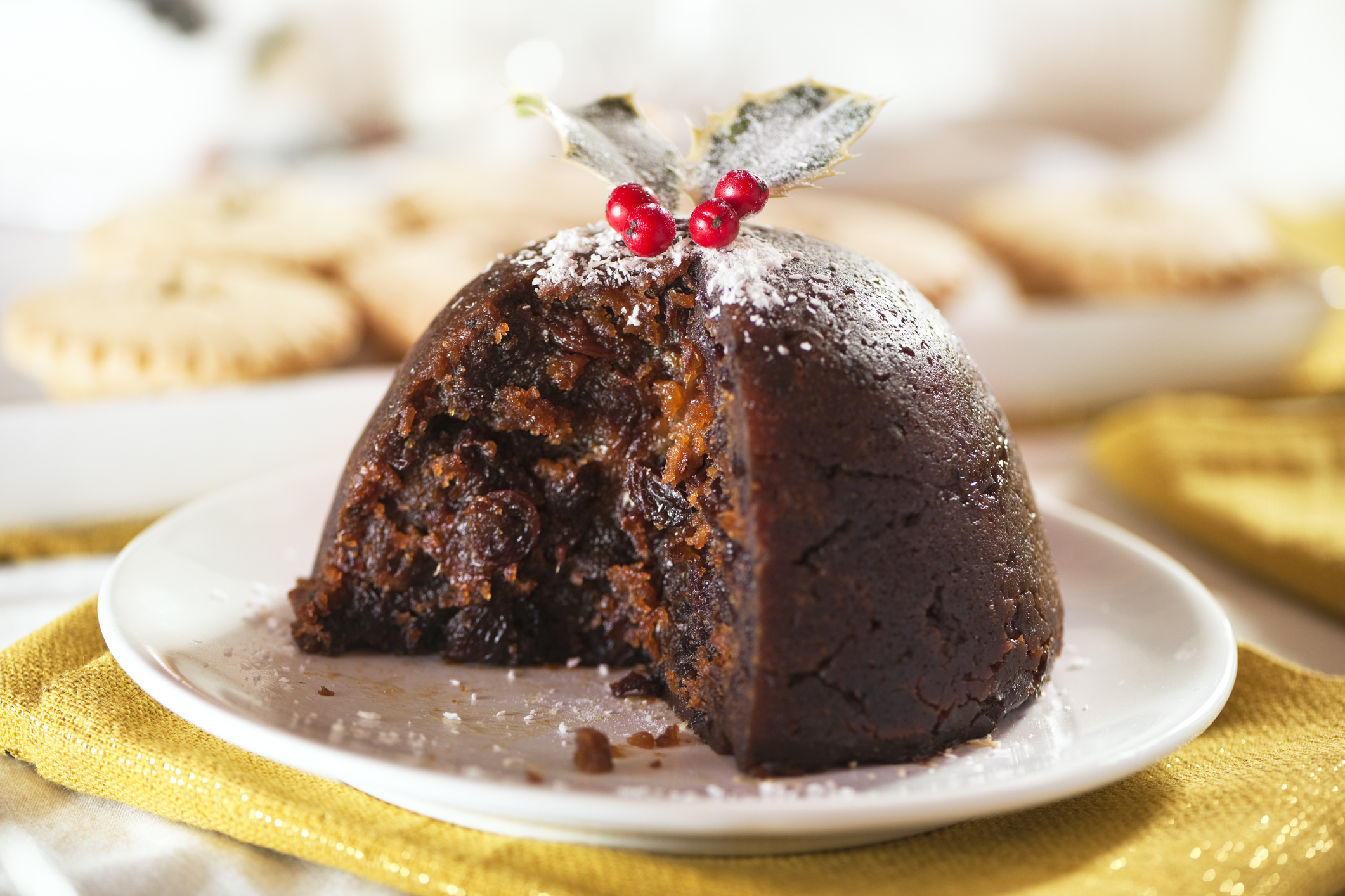 Festive plum pudding on a white plate