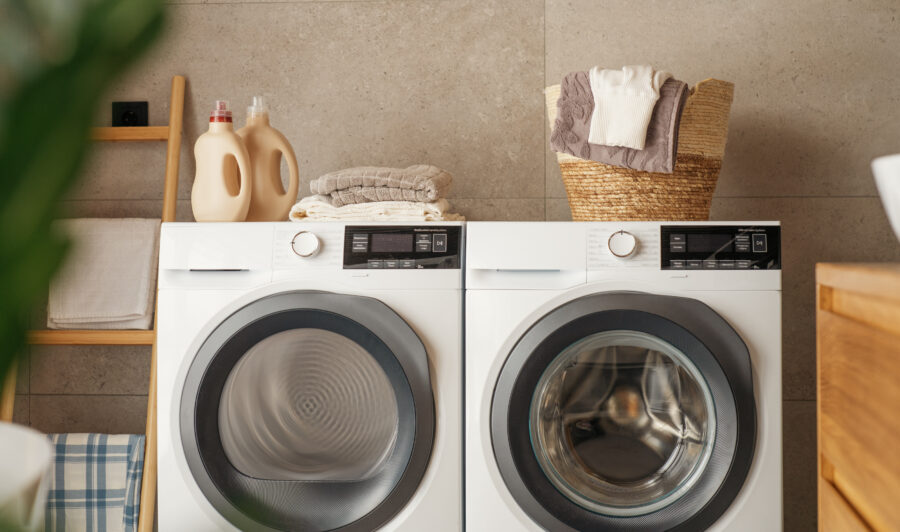 Interior of a real laundry room with a washing machine at home