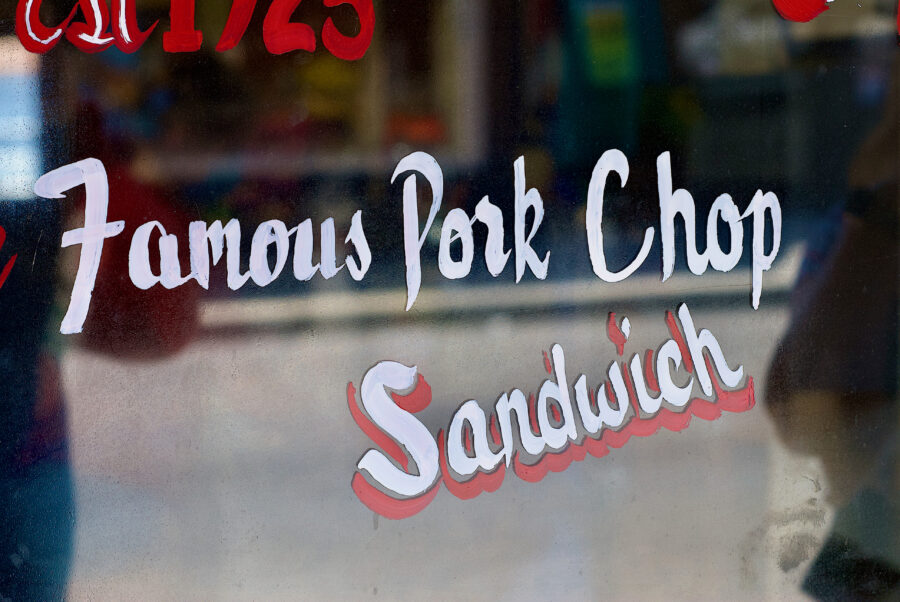 Mount Airy, North Carolina / USA - July 3, 2020: Close-up of the historic Snappy Lunch Diner window advertising their “Famous Pork Chop Sandwich” in downtown Mount Airy, opened in 1923.