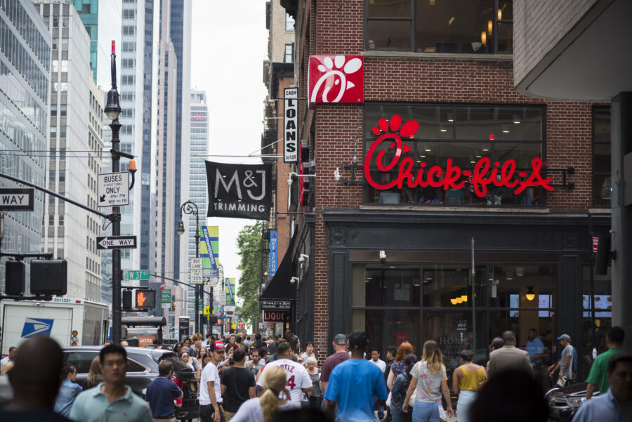 Pedestrians walk past a Chick-fil-A restaurant in Midtown Manhattan, New York City