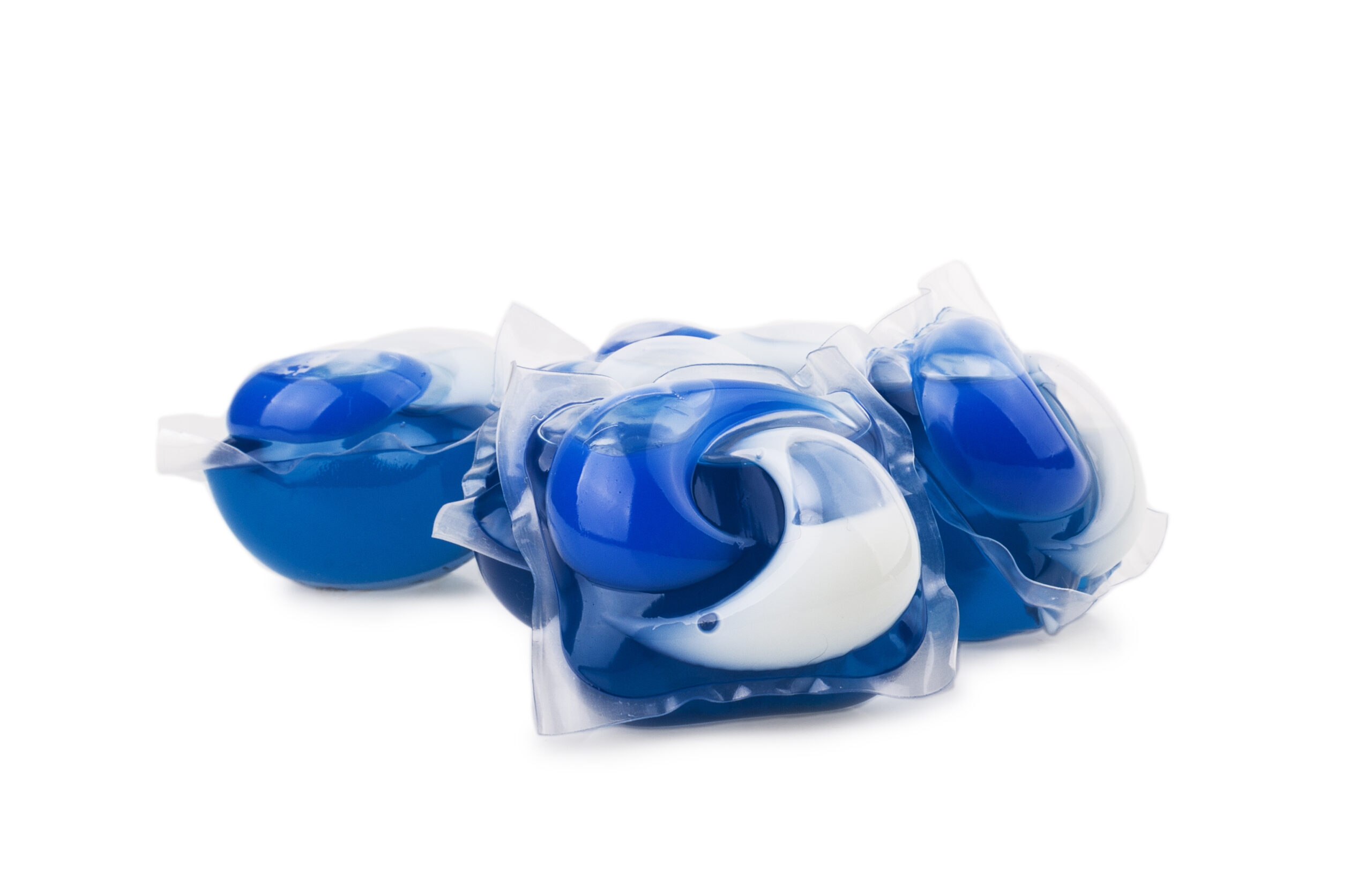 Pile of multiple washing pod capsules isolated over the white