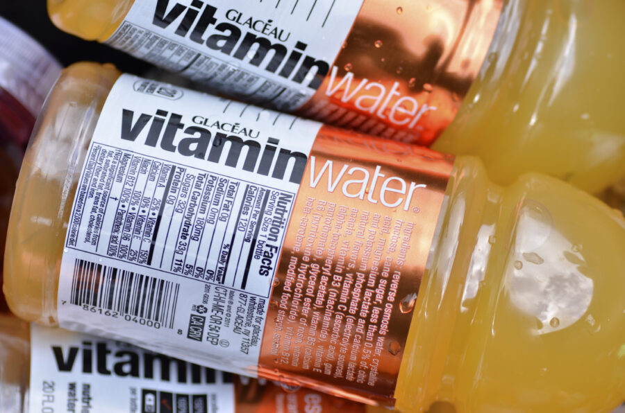 Bottles of orange Vitamin Water