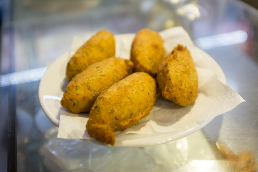 salt cod fritters or salt cod croquettes also known as Pastéis de bacalhau in Lisbon. They are also known as codfish cakes. Bacalhau (codfish) is one of the national dishes of Portugal