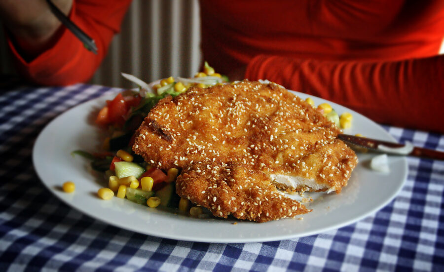 Shnitzel or Viennese breaded steak in restaurant.