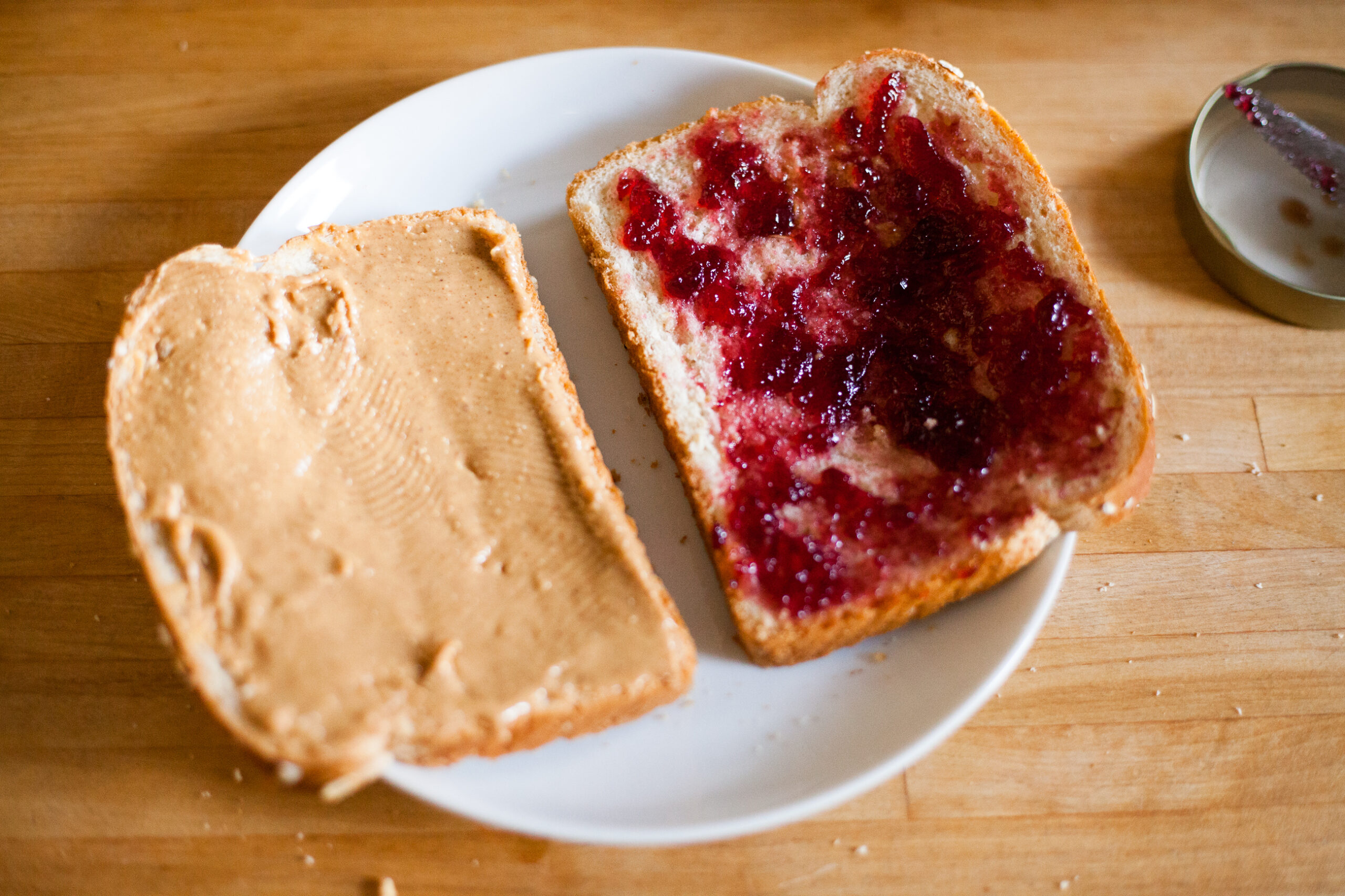 The making of a classic peanut butter and grape jelly sandwich.