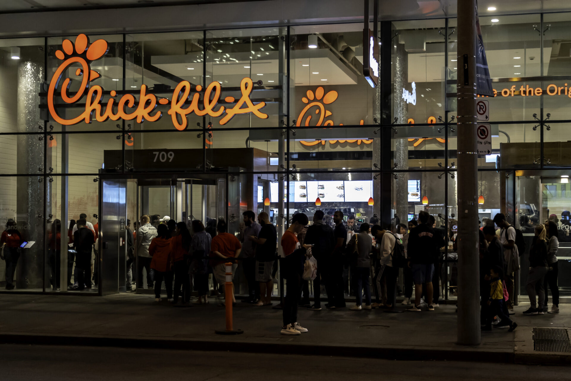 Sign of Chick-fil-A restaurant in the night in Toronto, Canada.