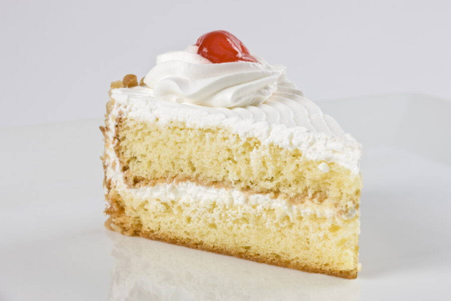 Vanilla cake slice with meringue icing.