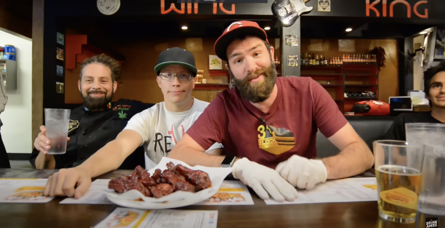 Three guys and a plate of hot wings. From Brian Ambs's YouTube video "HELLLL WINGS! SPICIEST MOMENT OF MY LIFE! | 30 hours of hellll..." 