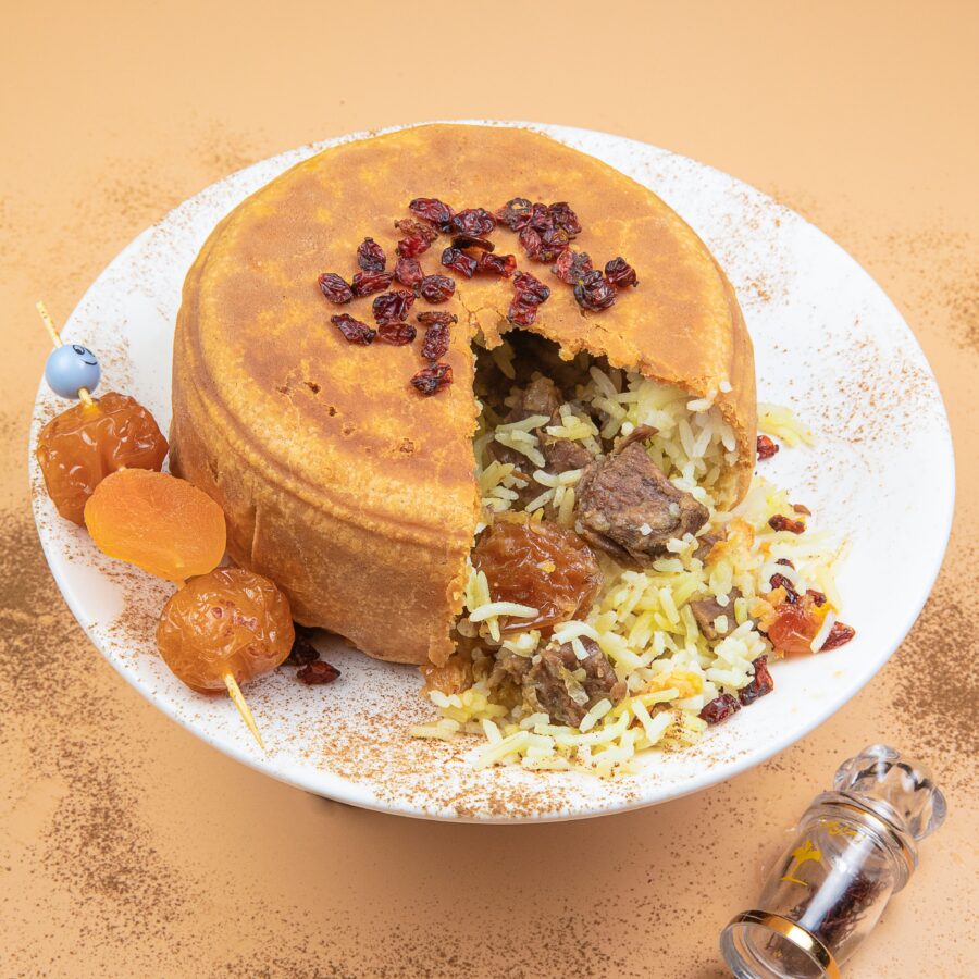 A closeup of Plov, a traditional Azerbaijani meal consisting of rice, beef, apricots, and chestnuts.