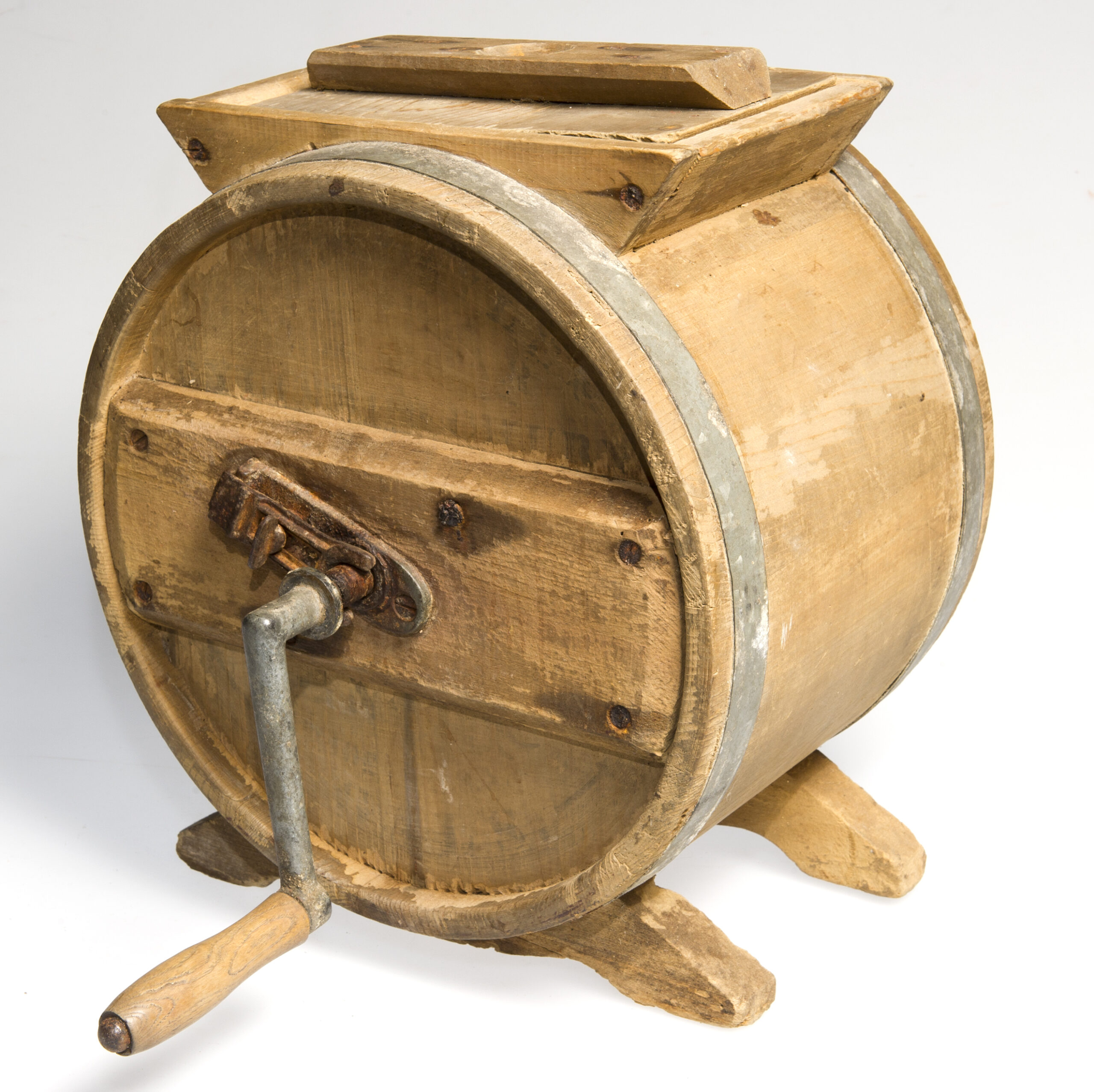 a wooden antique butter churn studio shot