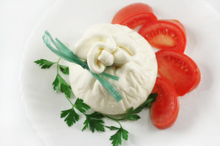 Buffalo Mozzarella Burrata with tomatoes, isolated