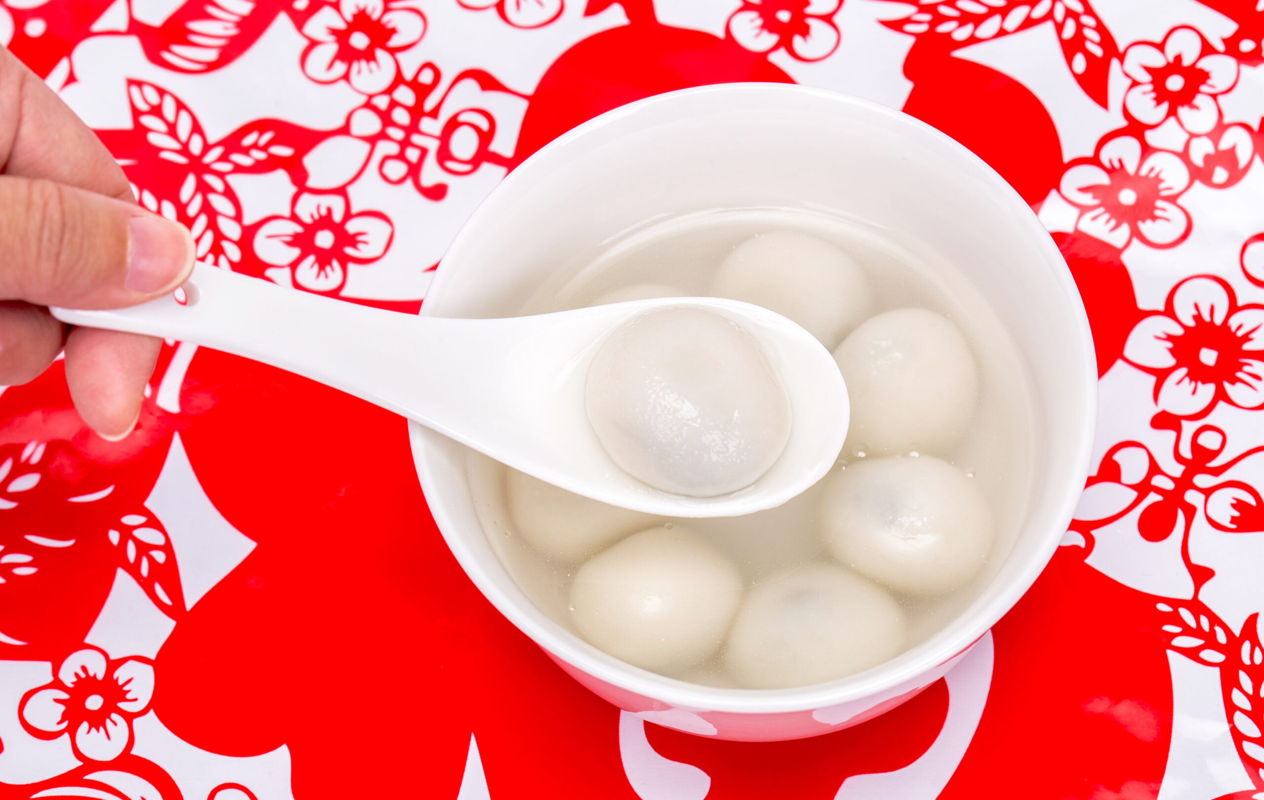 Chinese traditional Tangyuan on paper-cut window decoration