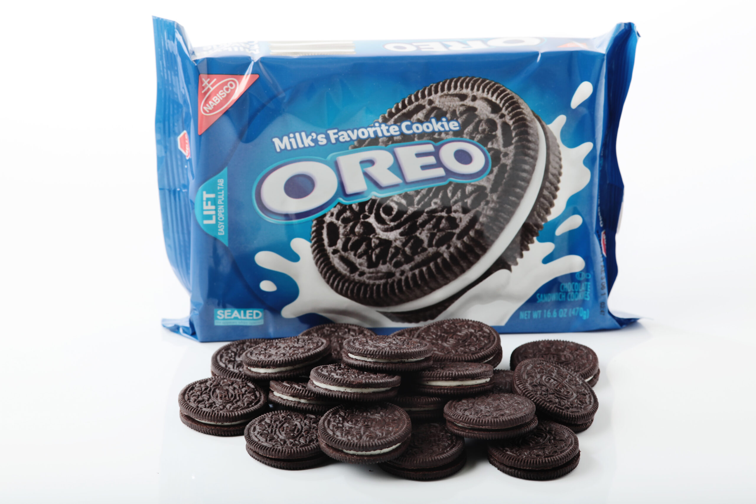 Colorado Springs, Colorado, USA - March 27, 2011 : A pack of oreo cookie and loose oreo cookies on a table against white background.