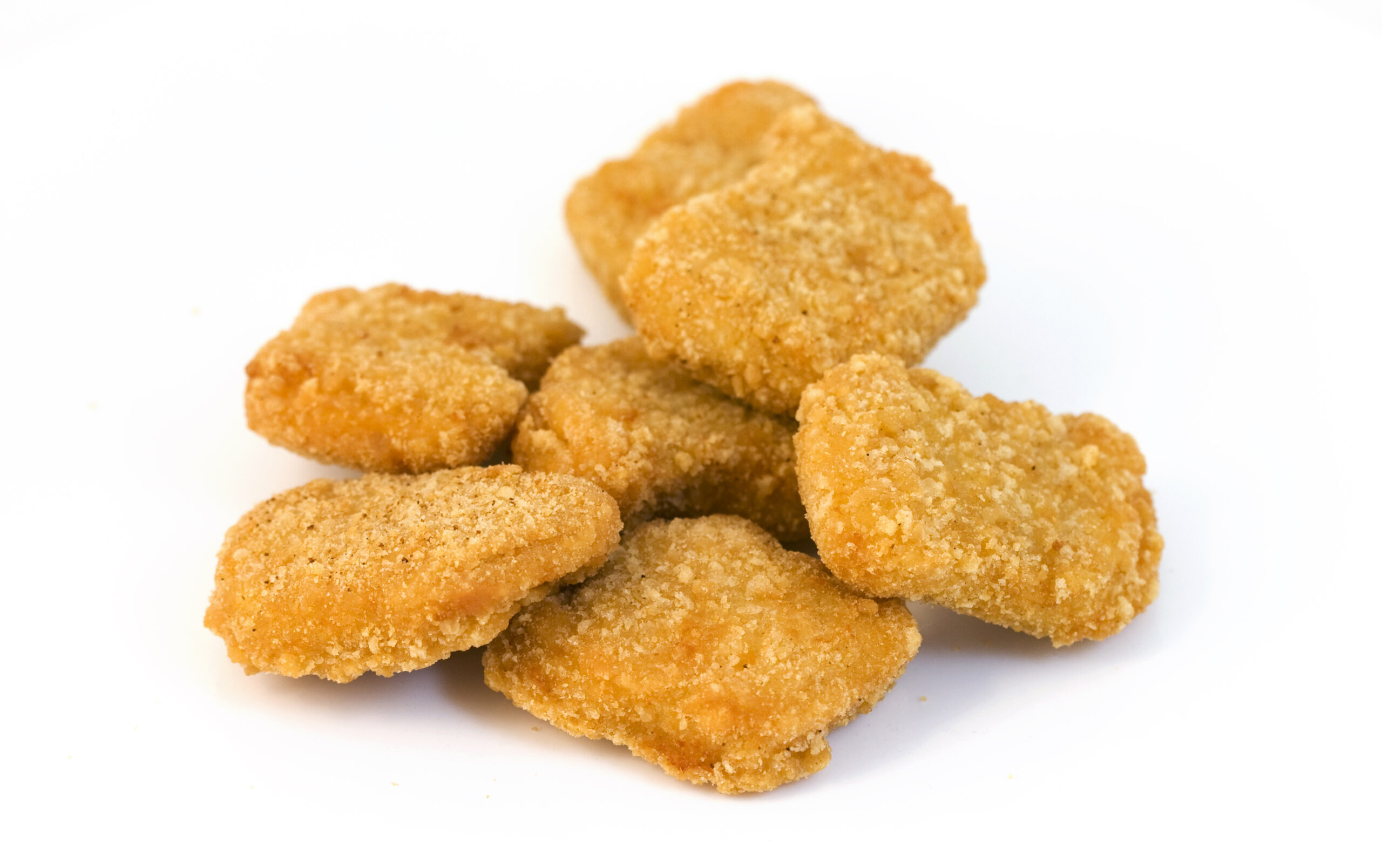 Deep fried chicken nuggets isolated on a white background.