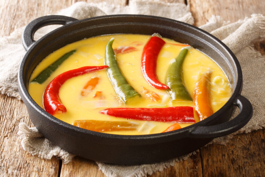 Ema Datshi Bhutanese Chili and Cheese Stew closeup in the pan on the table. horizontal