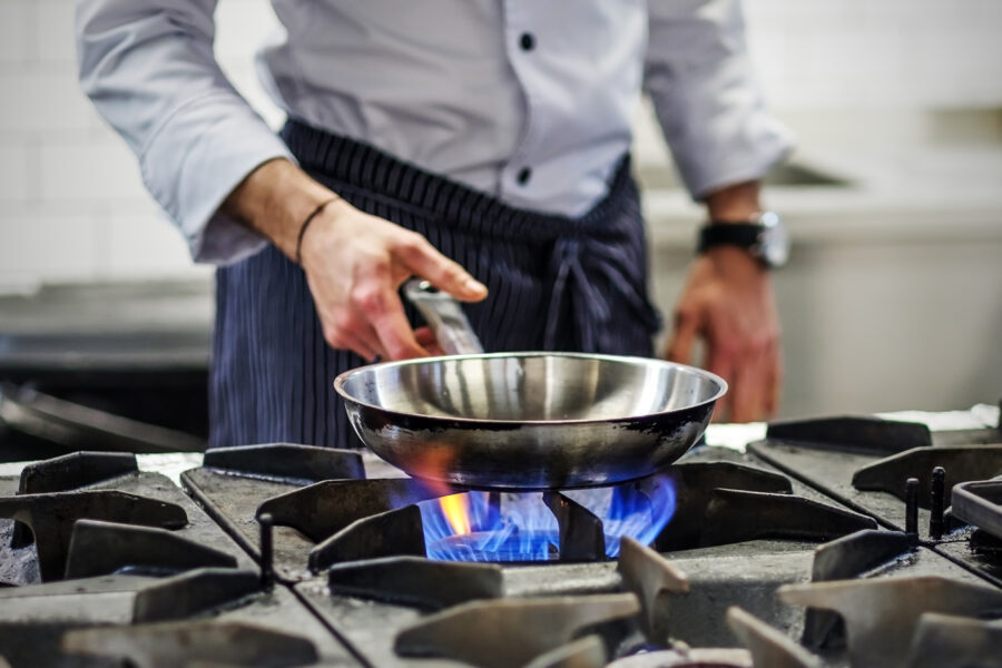 Frying pan on a gas stove. 