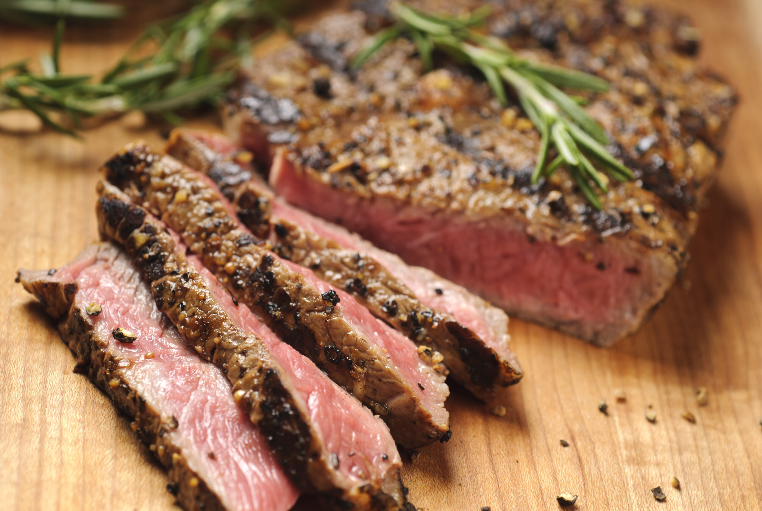 Grilled steak being sliced on a cutting board.  Please see my portfolio for other food related images.