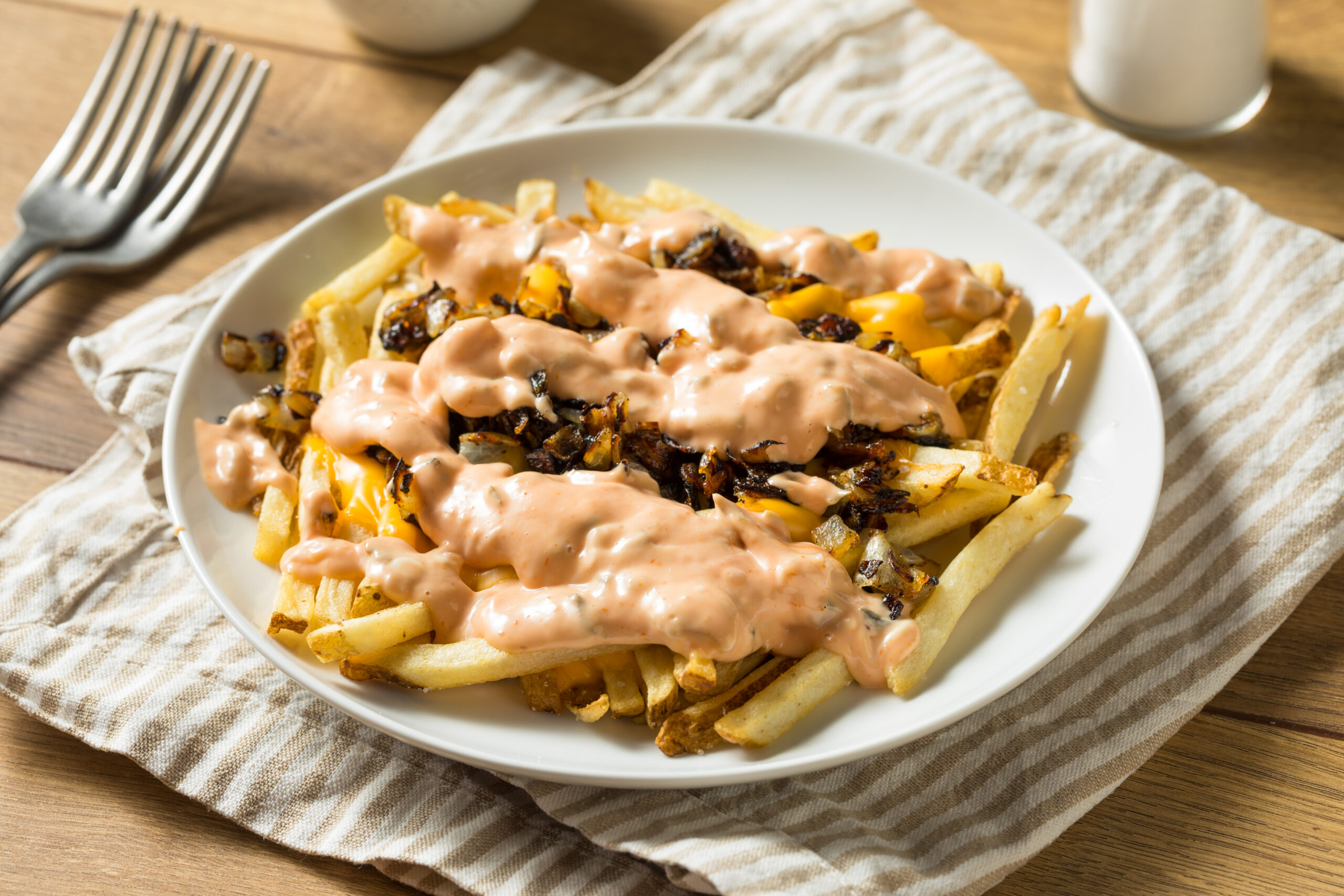 Homemade Fried Animal Cheese French Fries with Onions and Dressing