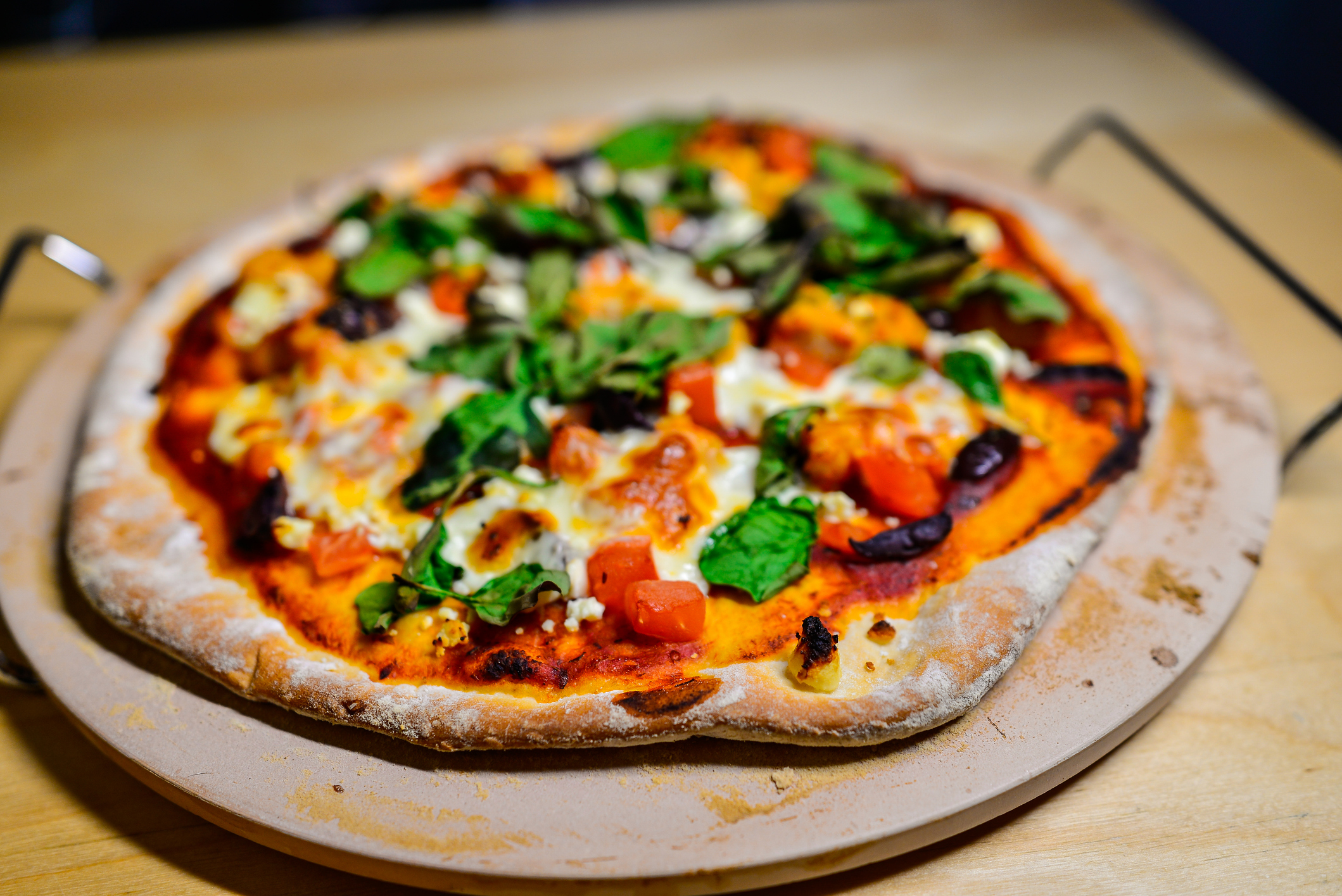 Homemade Pizza on Baking Stone - Shallow Selective Focus