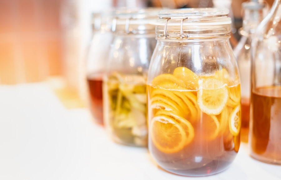 Homemade fermented raw kombucha tea with different flavorings, as  lemon organic probiotic drink. 