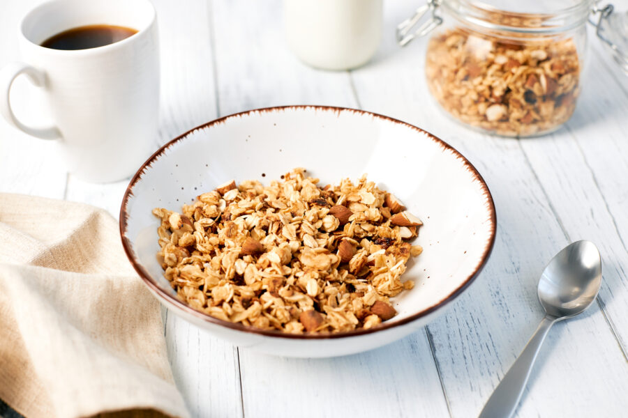 Granola with nuts and a cup of coffee for breakfast