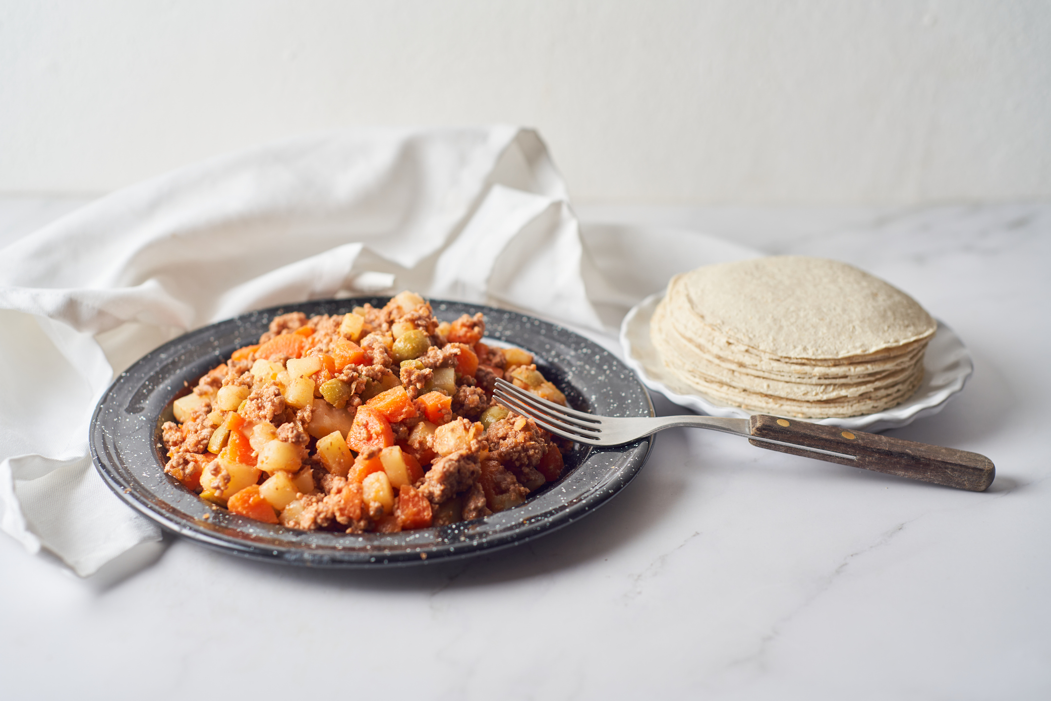 Delicious Picadillo cooked from ground beef with vegetables, mexican Dish