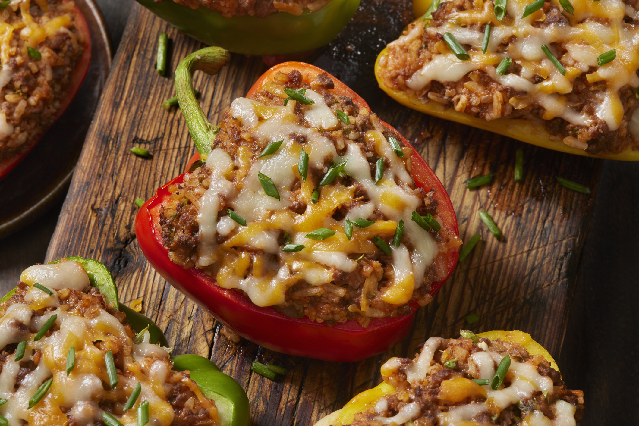 Italian Style Stuffed Peppers with Ground Beef, Rice, Tomato Sauce and Cheese