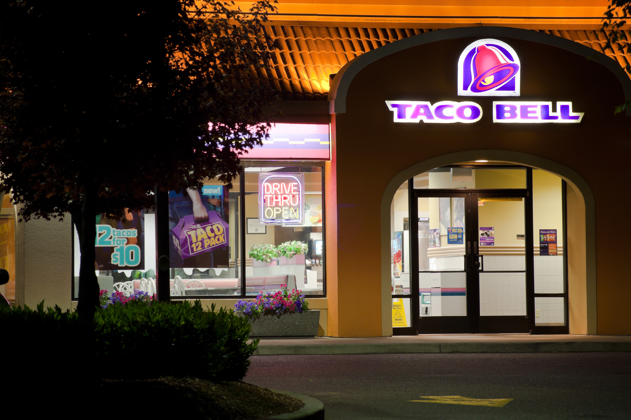 "Portland, Oregon, USA - July 7, 2011 - The entrance of a Taco Bell restaurant at night. This is the Jantzen Beach location (North Portland) of the Taco Bell chain."