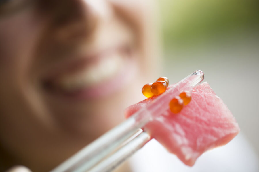 Eating sashimi, selective focus